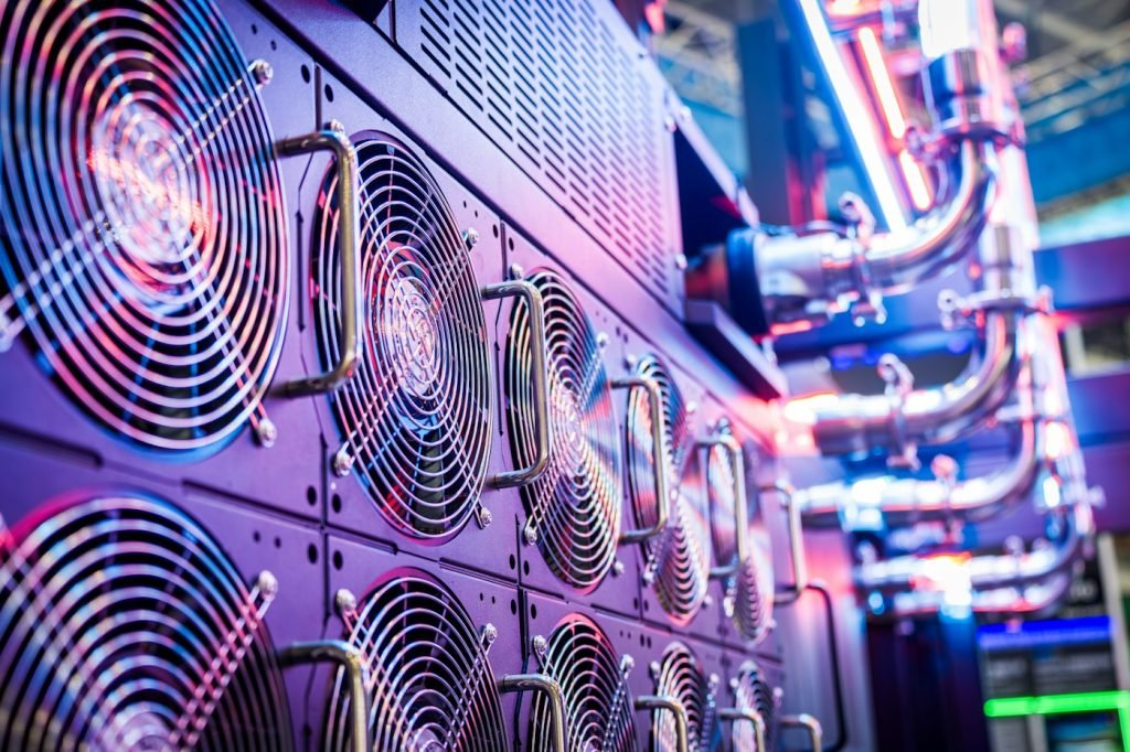 Rows of cooling fans and pipes in computing equipment