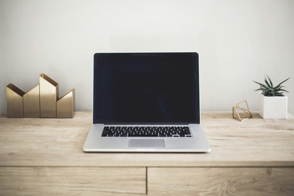 Laptop on a desk in a workspace