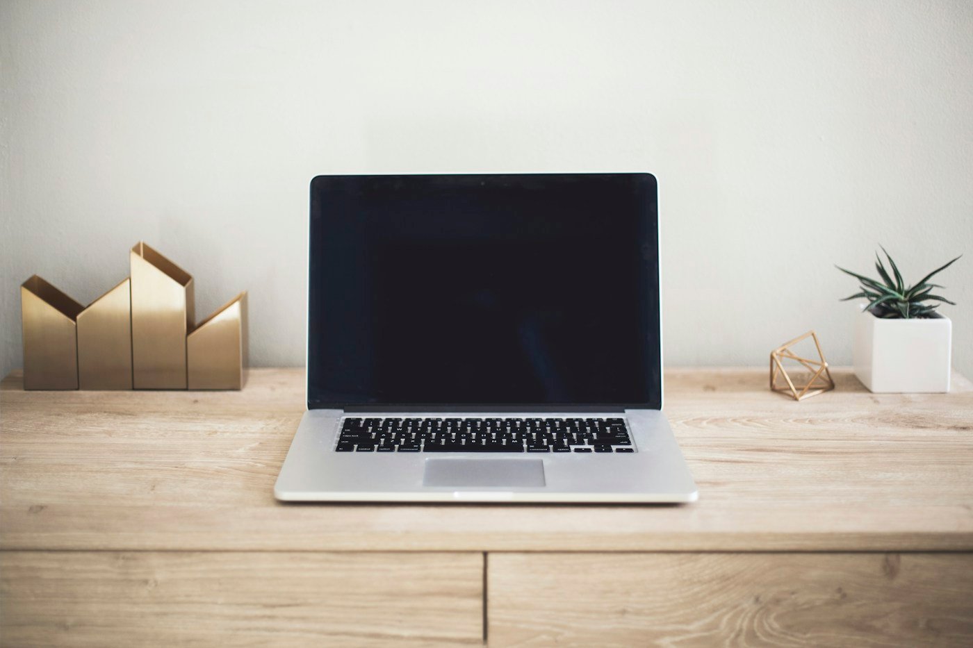 Laptop on a desk in a workspace