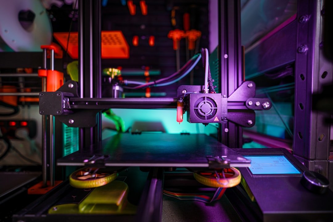 Desktop 3D printer with its print head above a build plate