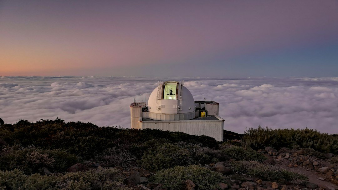 Isaac Newton Telescope dome above clouds on La Palma