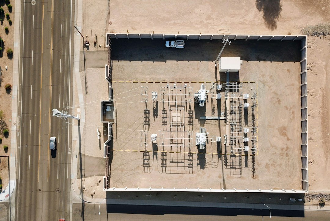 Overhead view of rooftop building machinery beside a road