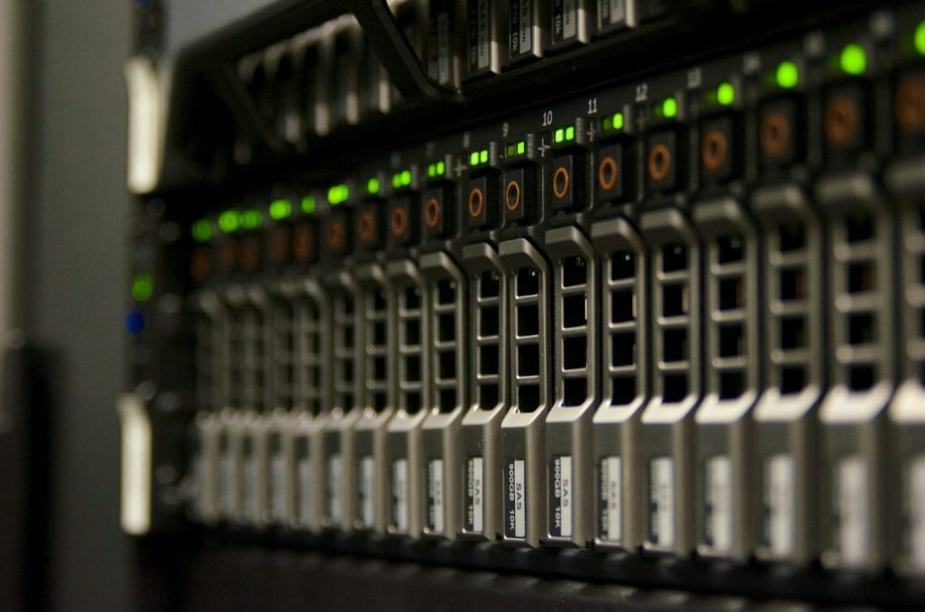 Close view of server drive bays with green status lights
