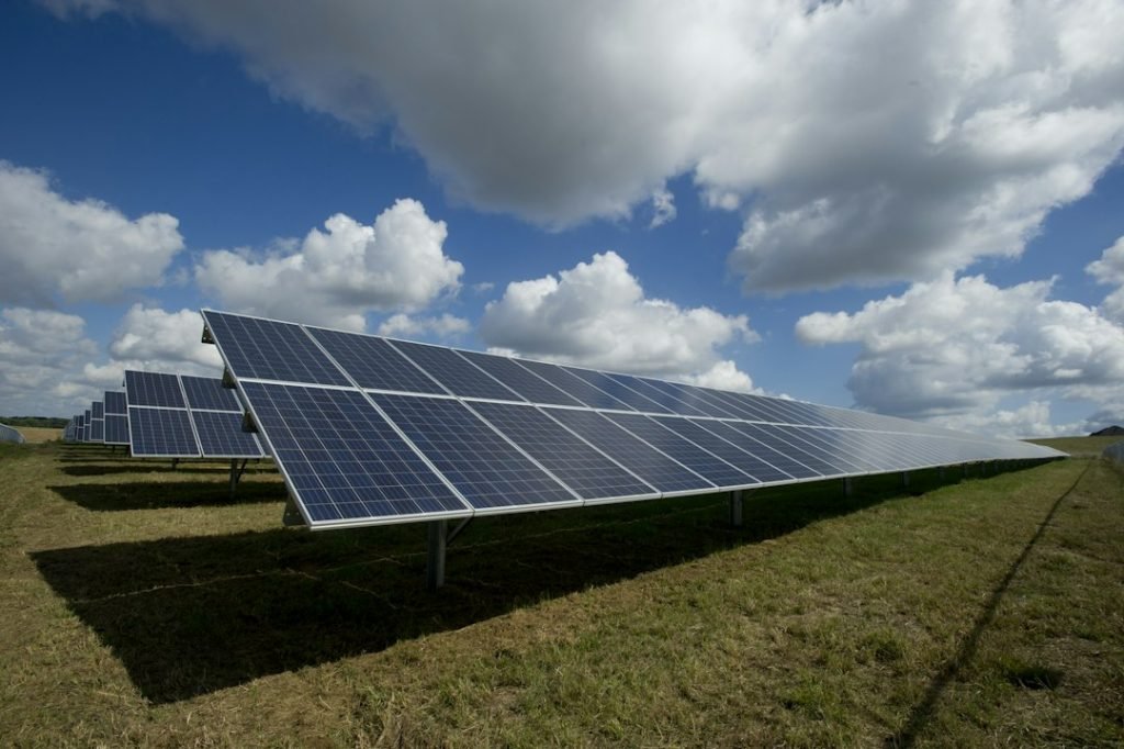 Rows of solar panels under an open sky; representative photograph.