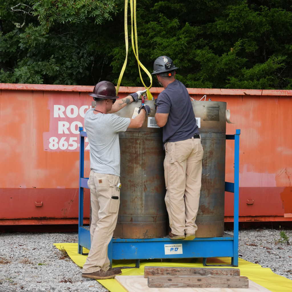 Workers prepare historic FLiBe salt canisters for shipment at Oak Ridge