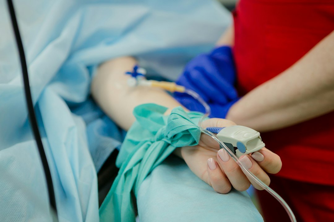 Patient receiving care in a clinical setting representing oncology treatment