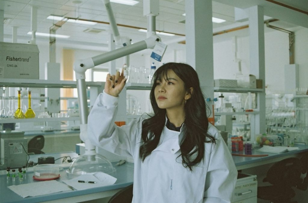Laboratory researcher examining a small sample