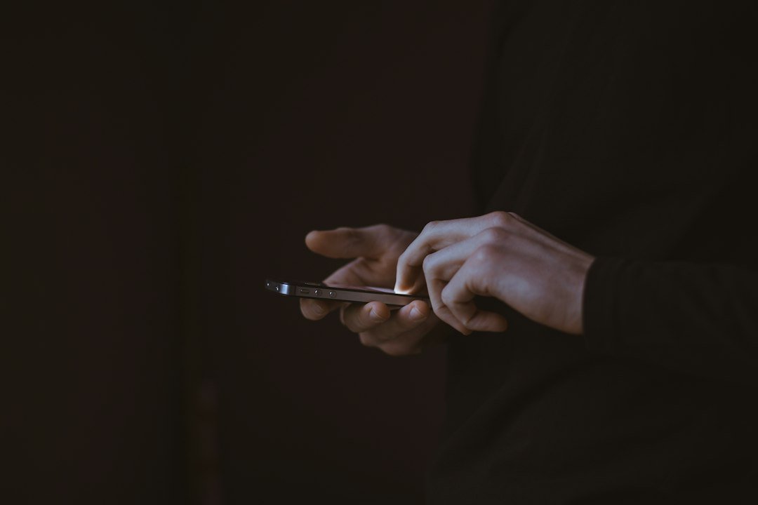 Person holding a smartphone, shown as a representative technology-use image