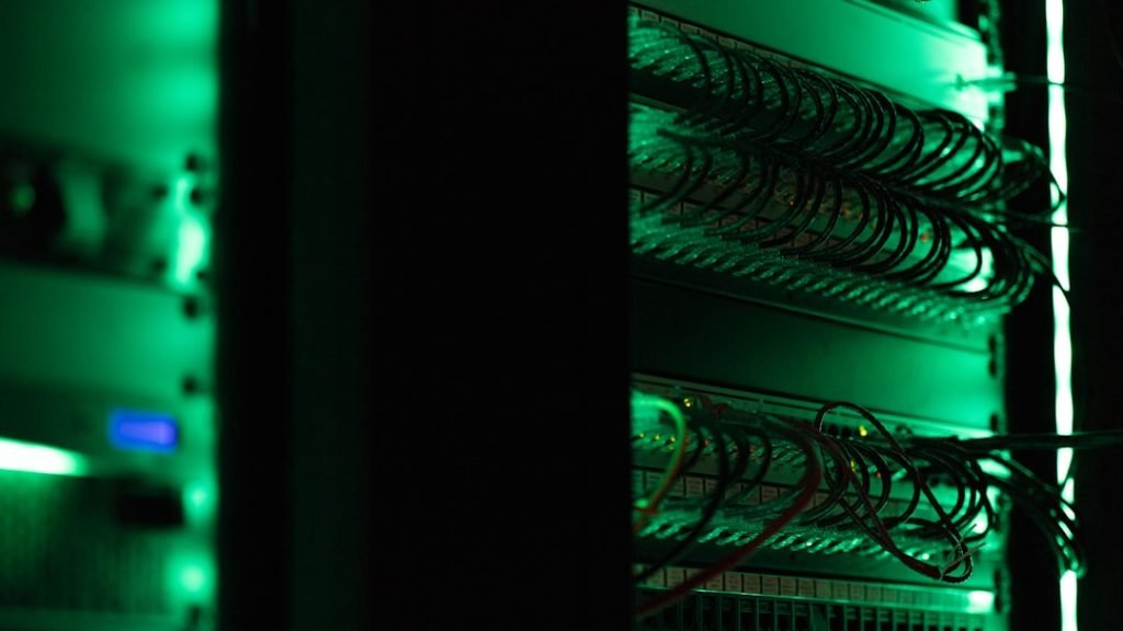 Rack of computing equipment in a dark server room