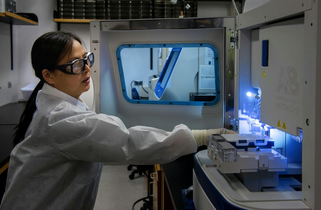 Scientist completing a laboratory genetic sequencing workflow