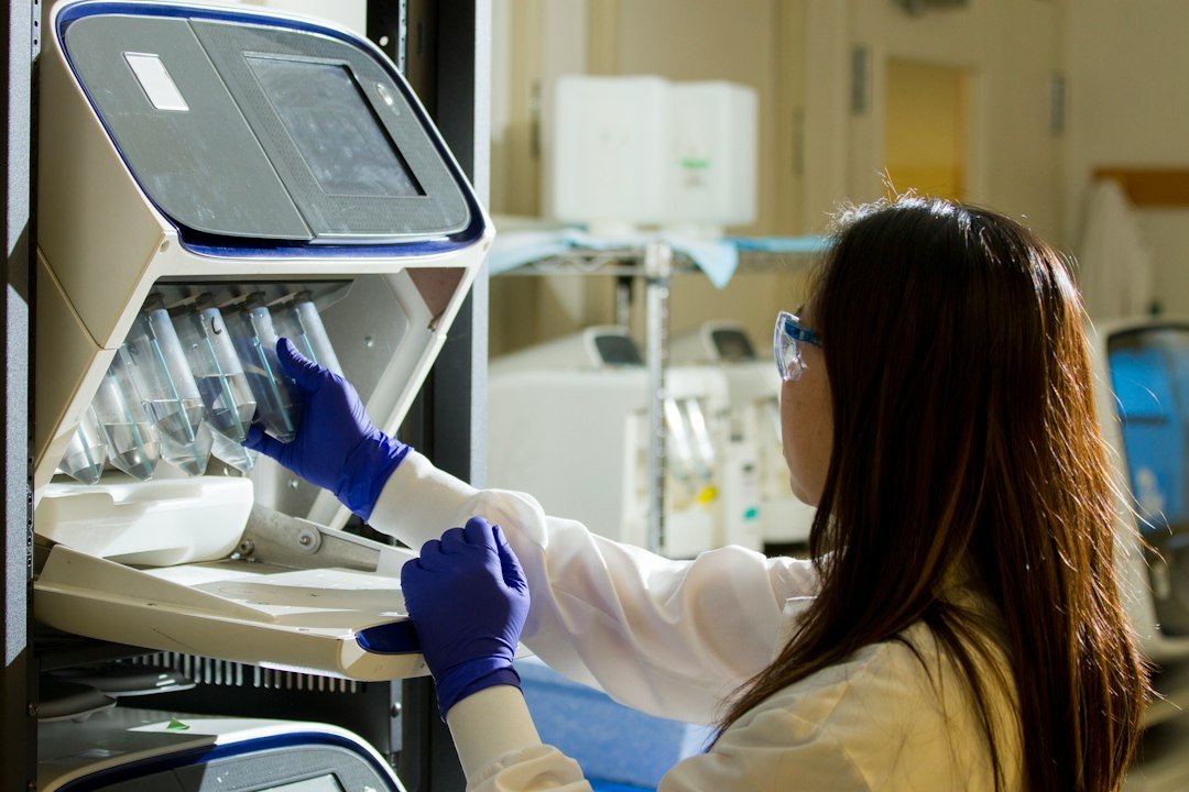 Technician preparing a sequencing experiment; contextual image, not the companion diagnostic.