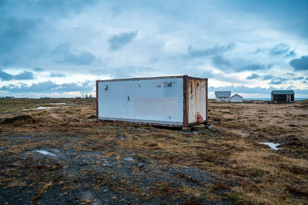 Industrial container in a remote landscape, used here as a conceptual image for modular battery storage