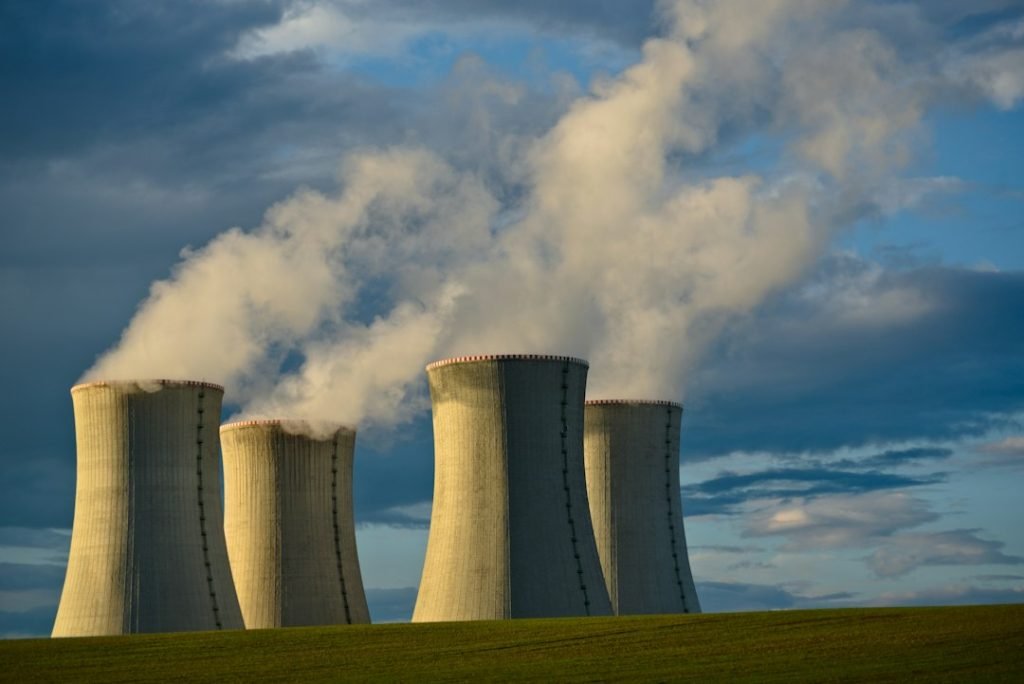 Nuclear power-station cooling towers representing commercial reactor regulation; not a DOE or DOD demonstration project.