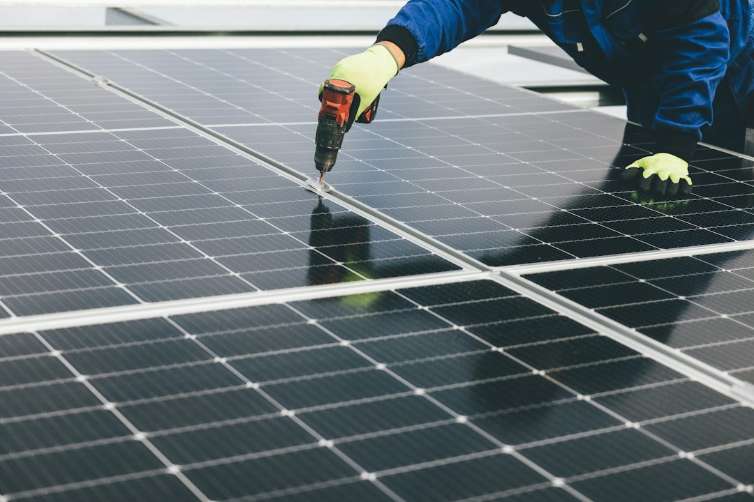 Workers installing solar panels; contextual image for clean-energy supply chains.